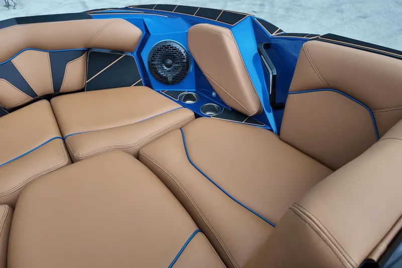 Yacht Photos Pics Luxurious interior of 2025 Centurion Fe23 boat with tan leather seating and blue accents.