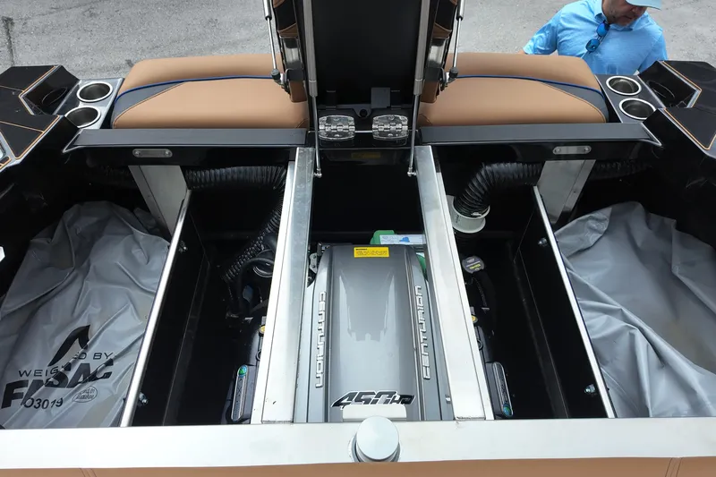  Yacht Photos Pics 2025 Centurion Fe23 boat engine compartment with seating and storage areas.