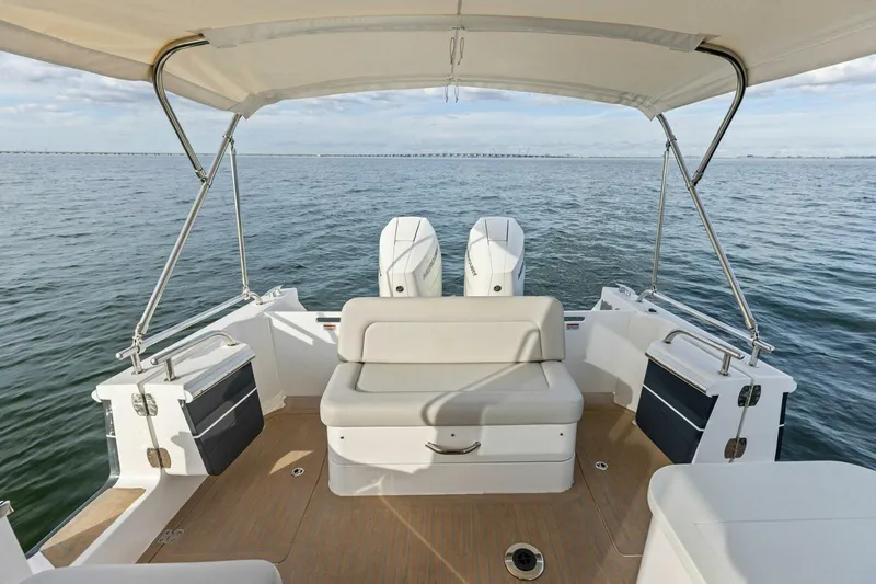  Yacht Photos Pics 2025 MJM 35 boat interior with seating, canopy, and ocean view.