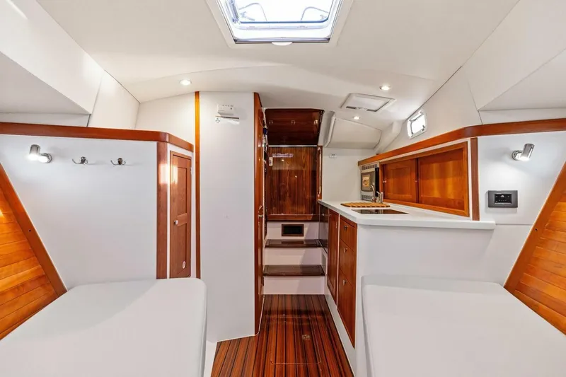  Yacht Photos Pics Luxurious interior of 2025 MJM 35 yacht with wood accents and modern amenities.