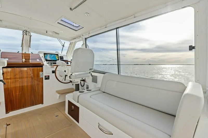  Yacht Photos Pics Interior of 2025 MJM 35 boat with helm, seating, and ocean view.