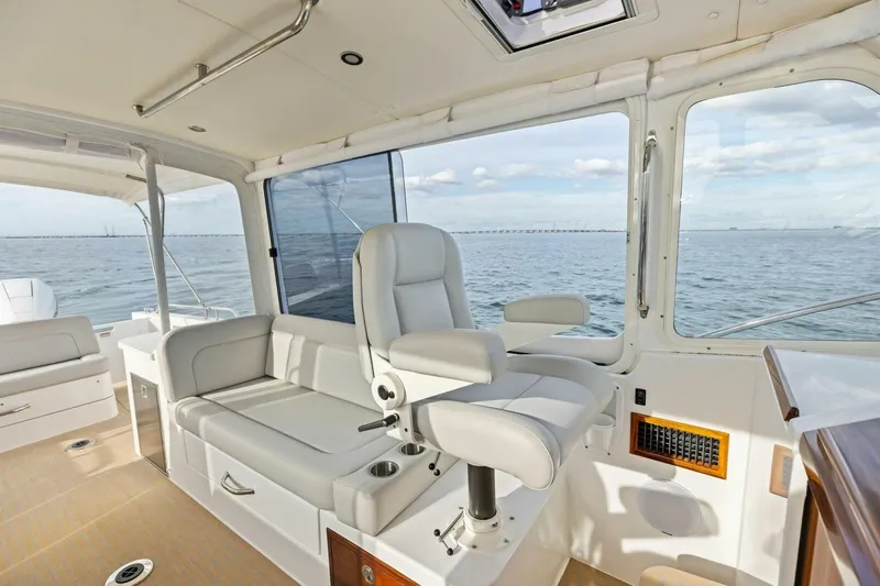  Yacht Photos Pics Luxurious interior of 2025 MJM 35 yacht with ocean view and comfortable seating.