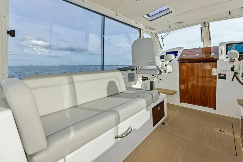  Yacht Photos Pics Interior of 2025 MJM 35 boat with seating and navigation equipment.