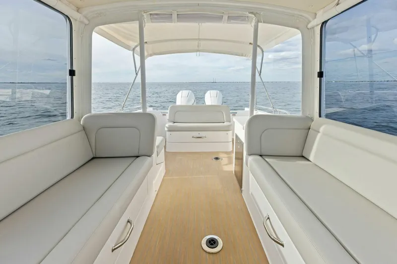  Yacht Photos Pics Interior view of 2025 MJM 35 boat with spacious seating and ocean backdrop.