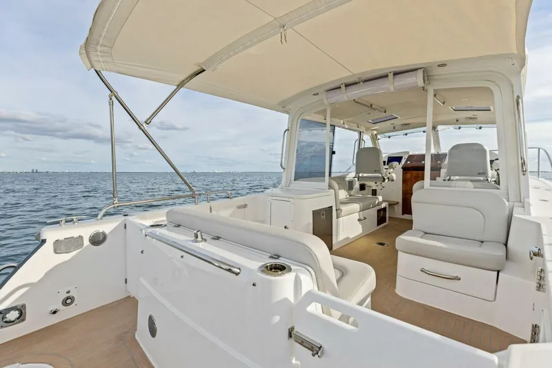  Yacht Photos Pics 2025 MJM 35 boat interior with seating, canopy, and ocean view.
