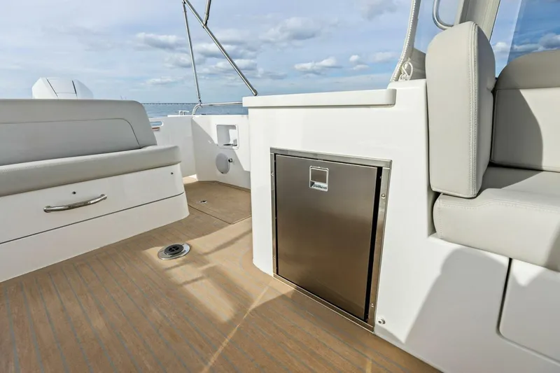  Yacht Photos Pics 2025 MJM 35 boat interior with seating and stainless steel storage.