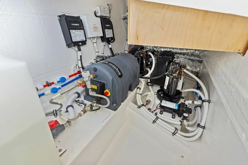  Yacht Photos Pics Engine room of 2025 MJM 35 boat with complex piping and machinery.