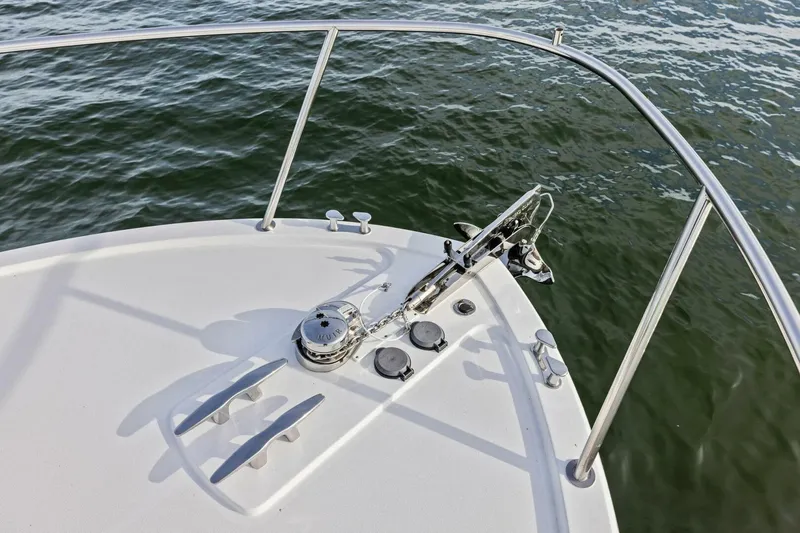  Yacht Photos Pics Bow of 2025 MJM 35 boat with anchor and railing over water.