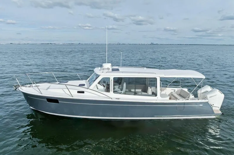  Yacht Photos Pics 2025 MJM 35 boat on calm water, showcasing sleek design and modern features.