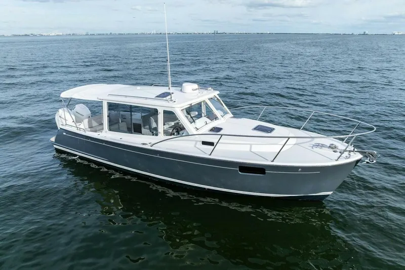  Yacht Photos Pics 2025 MJM 35 boat cruising on open water under a clear sky.