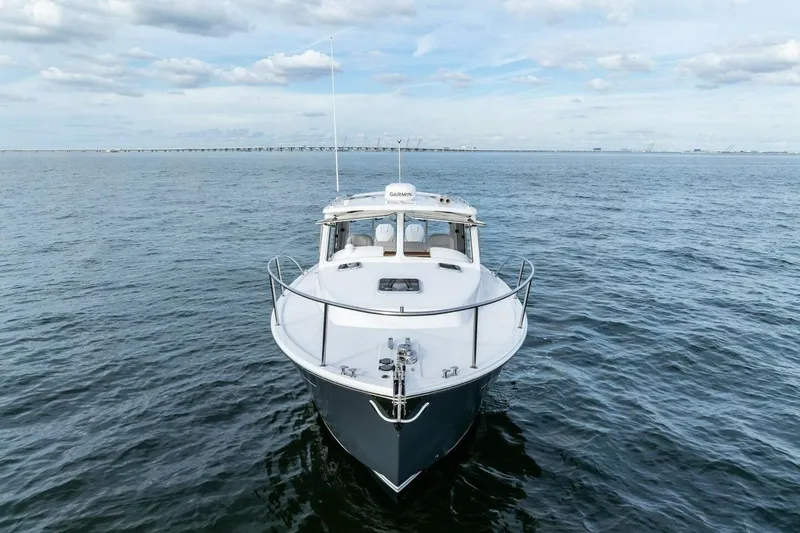  Yacht Photos Pics 2025 MJM 35 boat on open water under a cloudy sky.