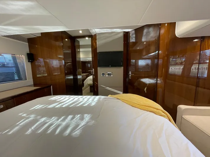  Yacht Photos Pics Luxurious cabin interior of 2017 Fairline Squadron 48 yacht with wood paneling.