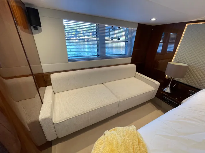  Yacht Photos Pics Luxurious interior of 2017 Fairline Squadron 48 yacht with elegant sofa and window view.
