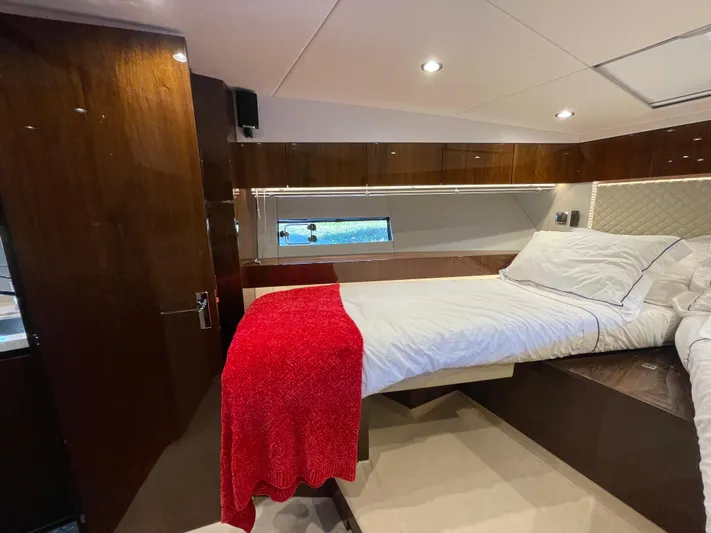  Yacht Photos Pics Luxurious cabin interior of 2017 Fairline Squadron 48 yacht with elegant wood finish.