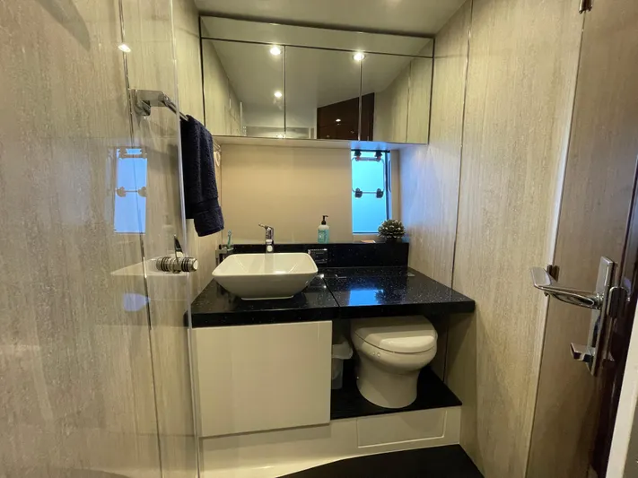  Yacht Photos Pics Luxurious bathroom in 2017 Fairline Squadron 48 yacht with modern fixtures and elegant design.