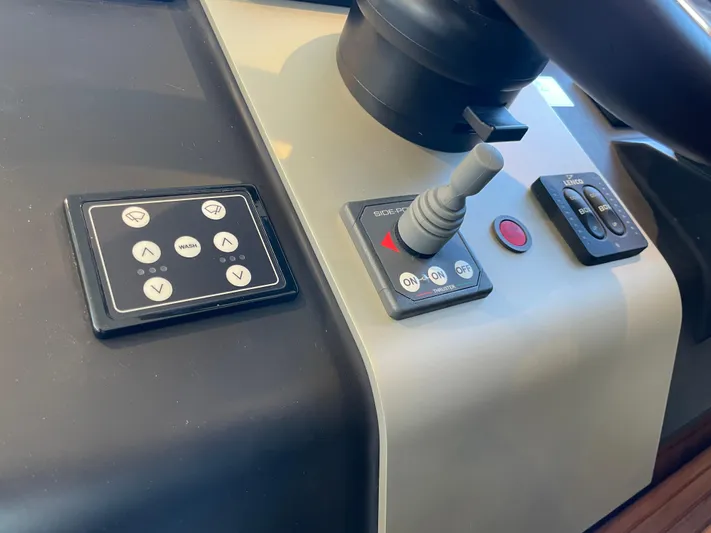  Yacht Photos Pics Control panel of 2017 Fairline Squadron 48 yacht with joystick and buttons.