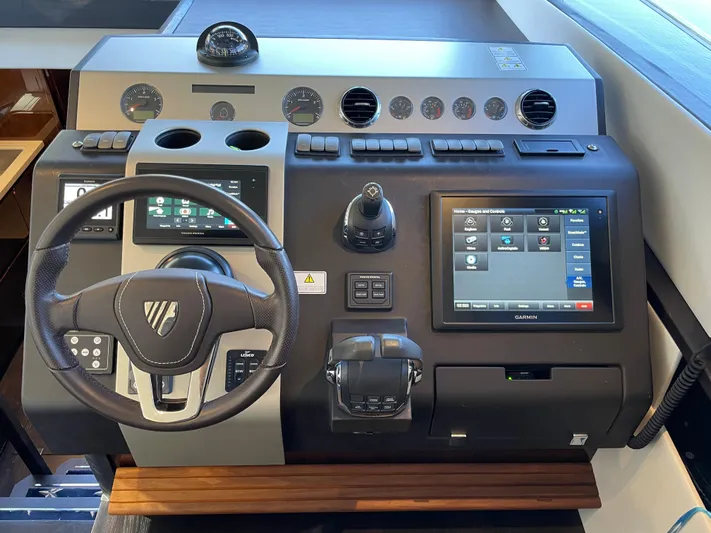  Yacht Photos Pics 2017 Fairline Squadron 48 helm with advanced navigation controls and touchscreen display.