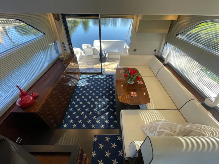  Yacht Photos Pics Luxurious interior of 2017 Fairline Squadron 48 yacht with elegant seating and star-patterned carpet.