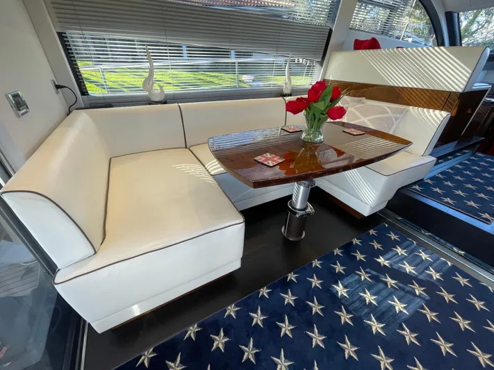  Yacht Photos Pics Luxurious interior of 2017 Fairline Squadron 48 yacht with elegant seating and table.