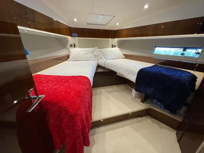  Yacht Photos Pics Luxurious twin cabin in 2017 Fairline Squadron 48 yacht with red and blue blankets.