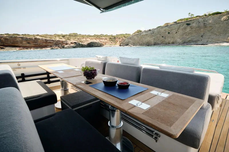  Yacht Photos Pics Luxury dining area on 2018 Fjord 52 Open yacht with ocean view.