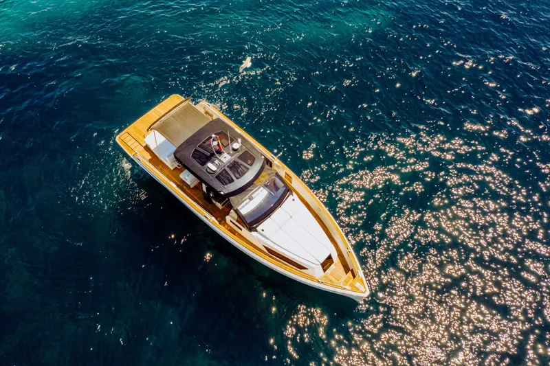  Yacht Photos Pics Aerial view of 2018 Fjord 52 Open yacht on sparkling blue water.