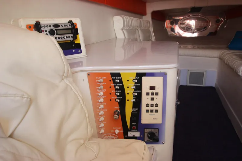  Yacht Photos Pics Interior of 2001 Cigarette 46 Rough Rider boat with control panels and white seating.