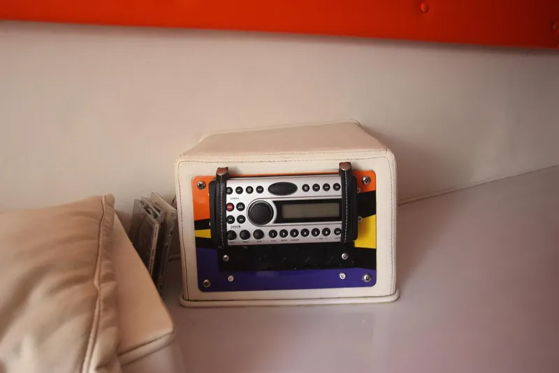  Yacht Photos Pics Radio system inside a 2001 Cigarette 46 Rough Rider boat, featuring a colorful panel design.