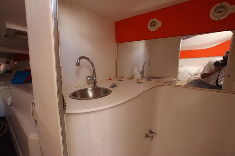  Yacht Photos Pics Interior of 2001 Cigarette 46 Rough Rider boat with sink and mirror.