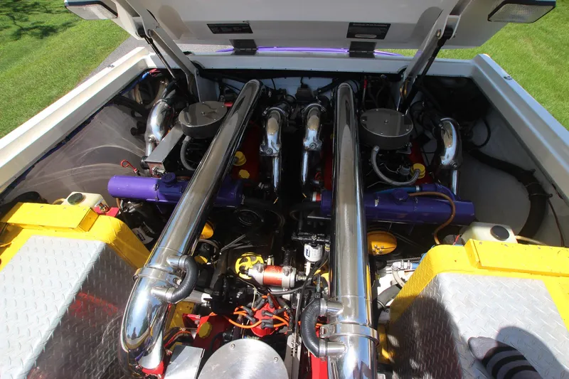  Yacht Photos Pics Engine compartment of a 2001 Cigarette 46 Rough Rider boat, featuring polished components.