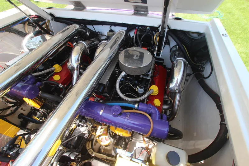  Yacht Photos Pics Engine compartment of a 2001 Cigarette 46 Rough Rider boat, showcasing dual engines.