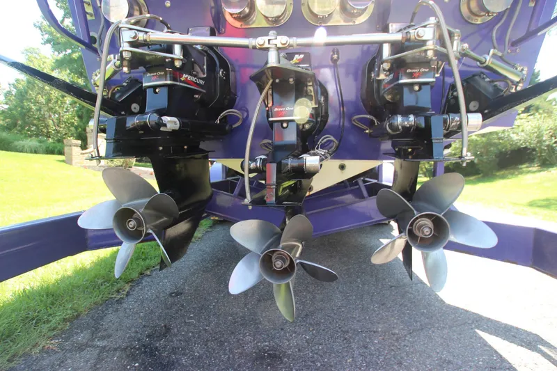  Yacht Photos Pics Triple propellers of a 2001 Cigarette 46 Rough Rider boat on display.