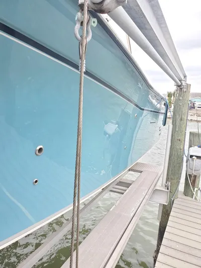 Rising Sun Yacht Photos Pics 2018 Grady-White Express 330 boat docked, showcasing sleek blue hull design.