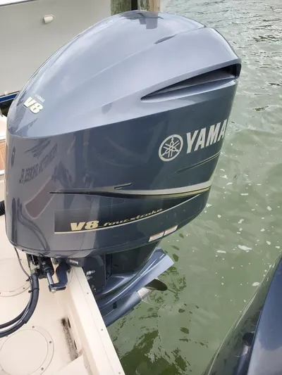 Rising Sun Yacht Photos Pics Yamaha V8 outboard motor on 2018 Grady-White Express 330 boat, docked by water.