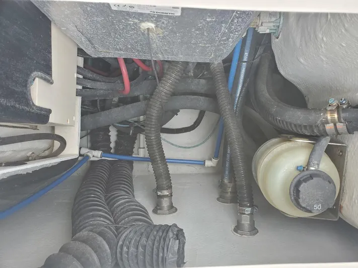 Rising Sun Yacht Photos Pics 2018 Grady-White Express 330 engine compartment with hoses and wiring.