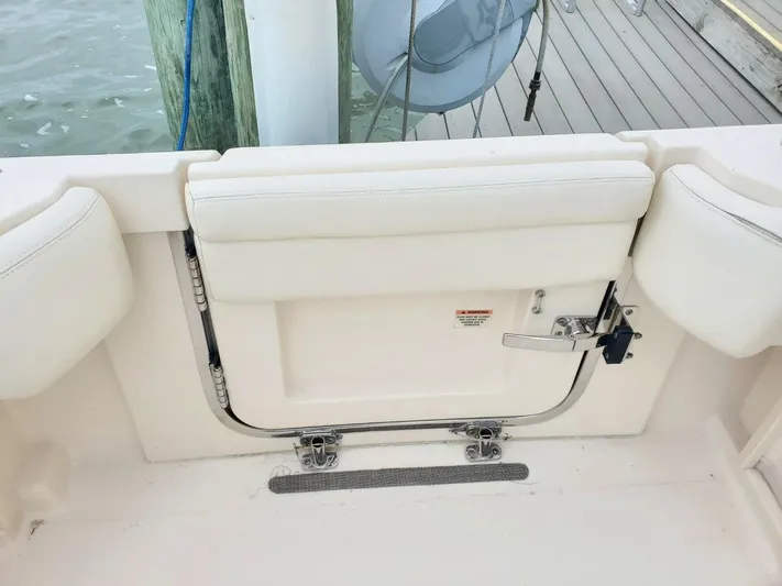 Rising Sun Yacht Photos Pics 2018 Grady-White Express 330 boat transom door, white upholstery, dockside view.
