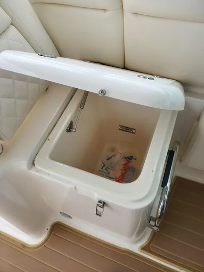 Rising Sun Yacht Photos Pics 2018 Grady-White Express 330 boat storage compartment with open lid, beige interior.