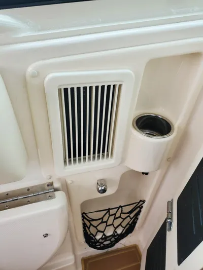 Rising Sun Yacht Photos Pics 2018 Grady-White Express 330 interior detail with vent, cup holder, and storage net.