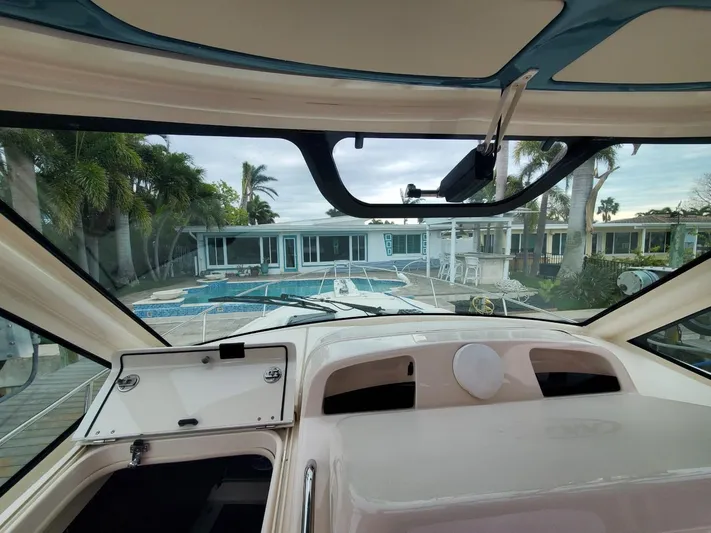 Rising Sun Yacht Photos Pics View from 2018 Grady-White Express 330 boat cockpit towards a luxurious waterfront home.