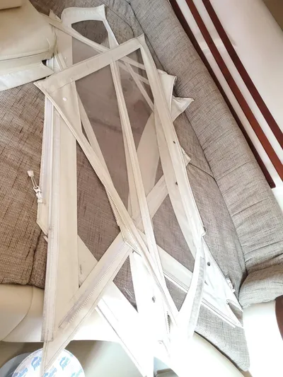 Rising Sun Yacht Photos Pics 2018 Grady-White Express 330 boat interior with canvas and clear vinyl panels.