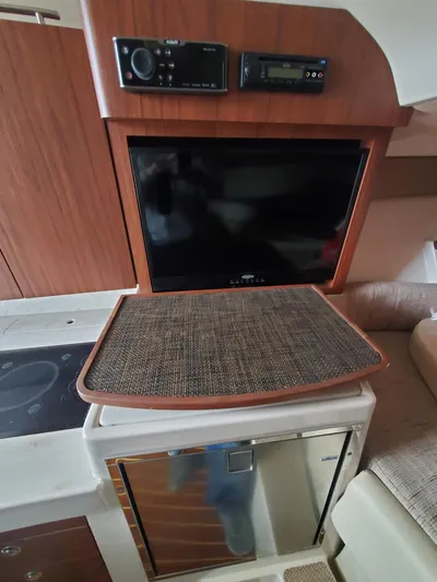 Rising Sun Yacht Photos Pics Interior of 2018 Grady-White Express 330 boat with TV and kitchenette.