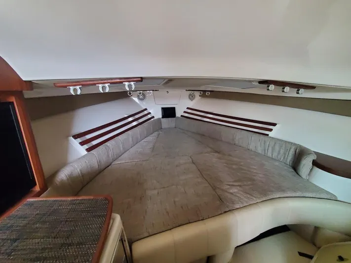 Rising Sun Yacht Photos Pics 2018 Grady-White Express 330 cabin interior with spacious bed and modern lighting.