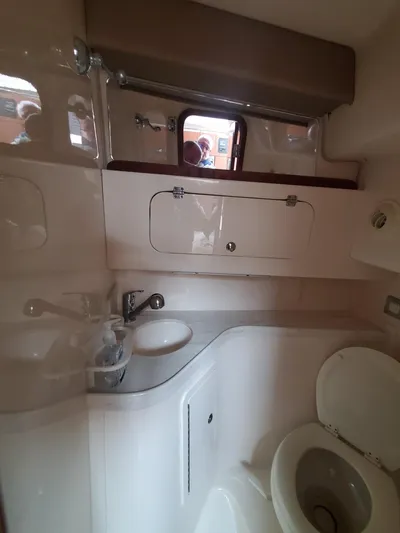 Rising Sun Yacht Photos Pics 2018 Grady-White Express 330 boat bathroom interior with sink and toilet.