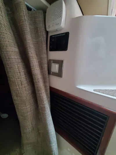 Rising Sun Yacht Photos Pics 2018 Grady-White Express 330 interior with curtain, vent, and control panel.