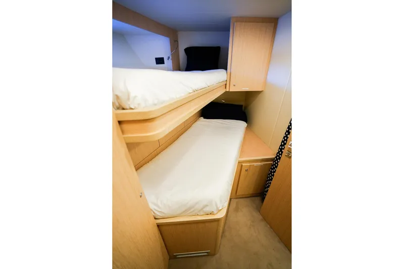 Toro Yacht Photos Pics Bunk beds in 2017 Ferretti Yachts 850 cabin with light wood finish.