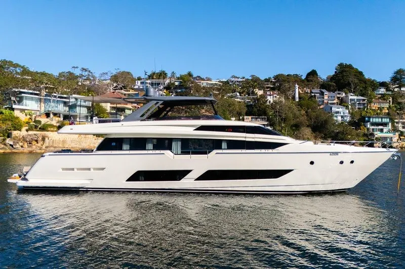 Toro Yacht Photos Pics 2017 Ferretti Yachts 850 luxury yacht on serene water, with scenic coastal backdrop.