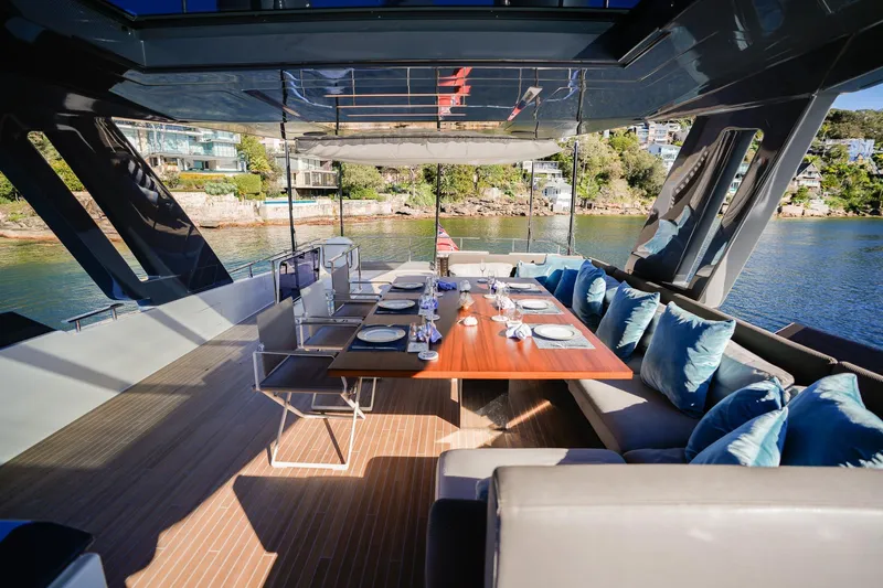 Toro Yacht Photos Pics Luxurious 2017 Ferretti Yachts 850 with elegant outdoor dining area and scenic waterfront view.