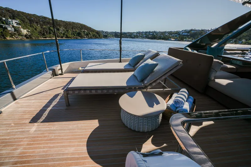 Toro Yacht Photos Pics Luxurious deck of 2017 Ferretti Yachts 850 with sun loungers and scenic water view.