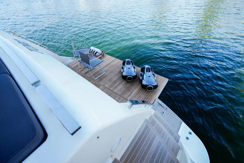 Toro Yacht Photos Pics Luxury Ferretti Yachts 850, 2017 model, with water toys on deck by the sea.