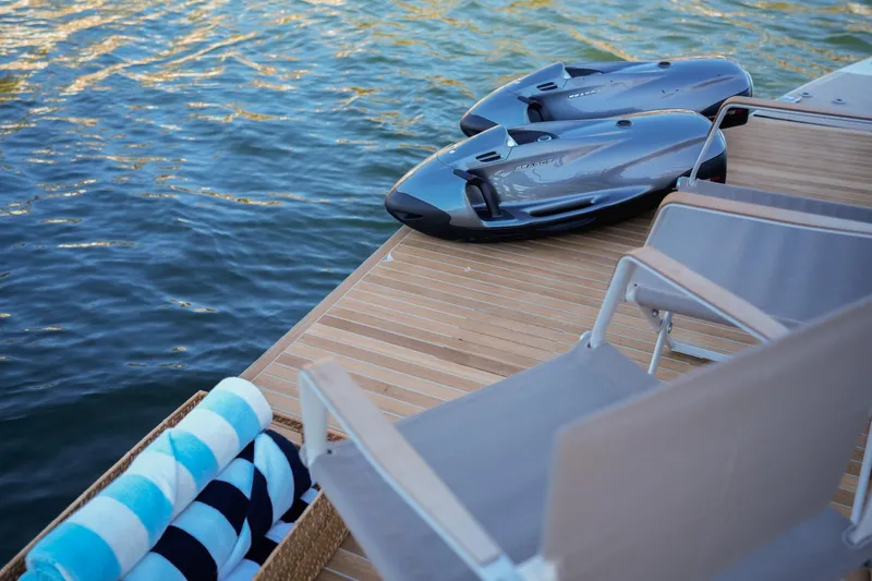 Toro Yacht Photos Pics Luxurious 2017 Ferretti Yachts 850 deck with water toys and lounge chairs.